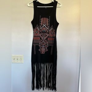 Black with Aztec design on front. Long fringe on bottom.